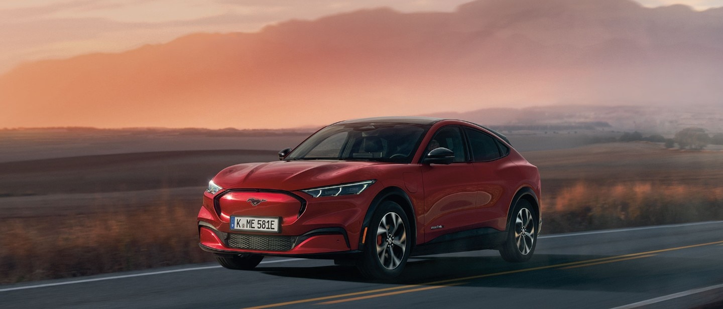 A red  Mustang Mach-E in sunset