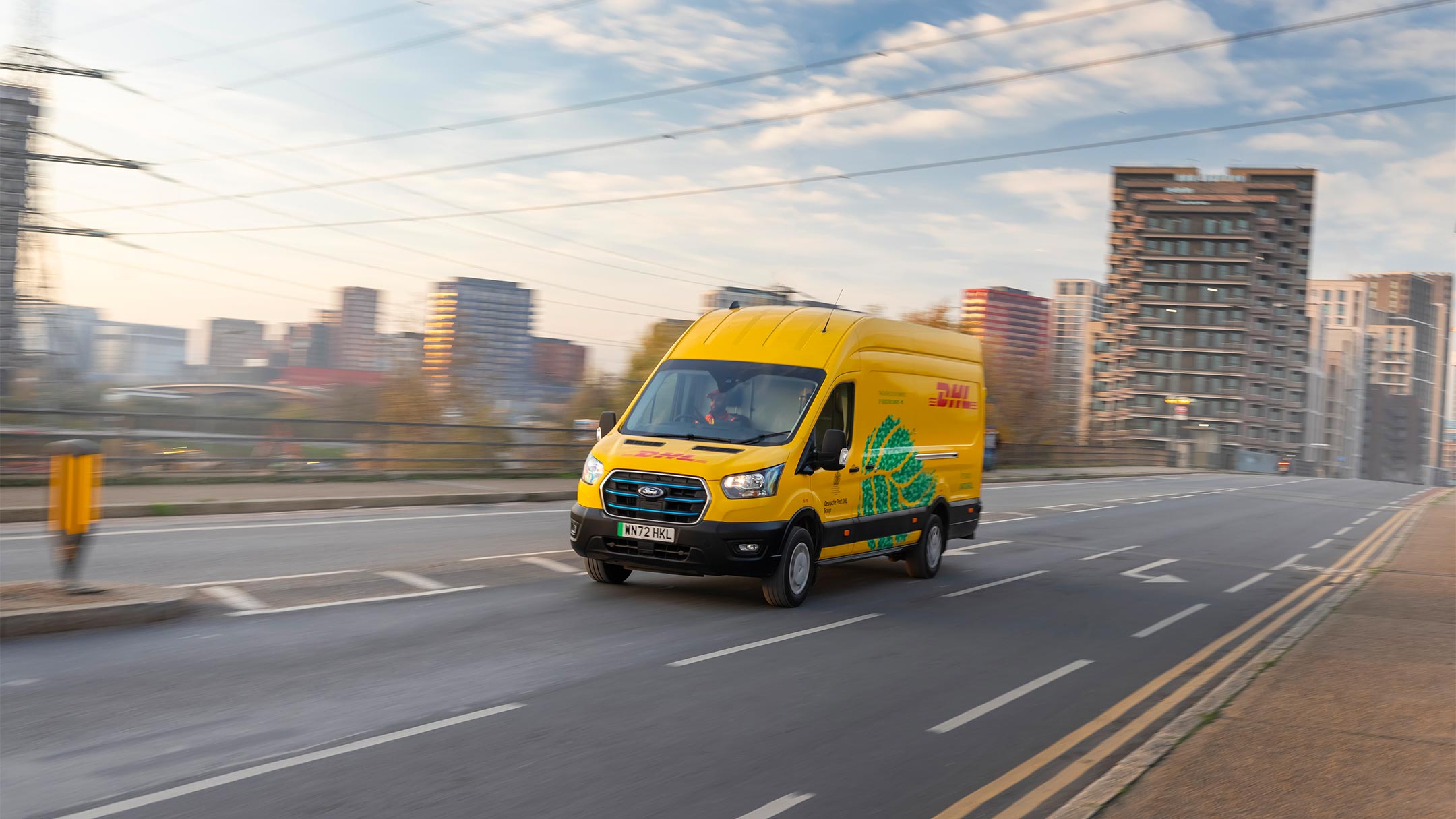 Ford E-Transit in the colours of DHL driving