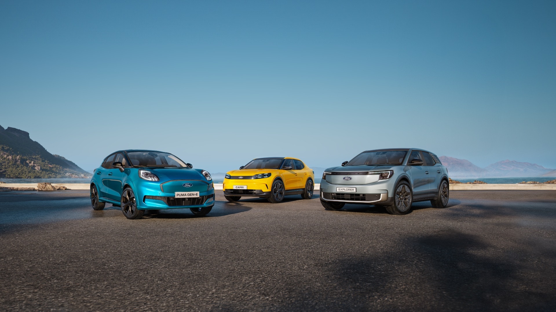 Puma Gen-E, Explorer e Capri in primo piano parcheggiati su una spiaggia.