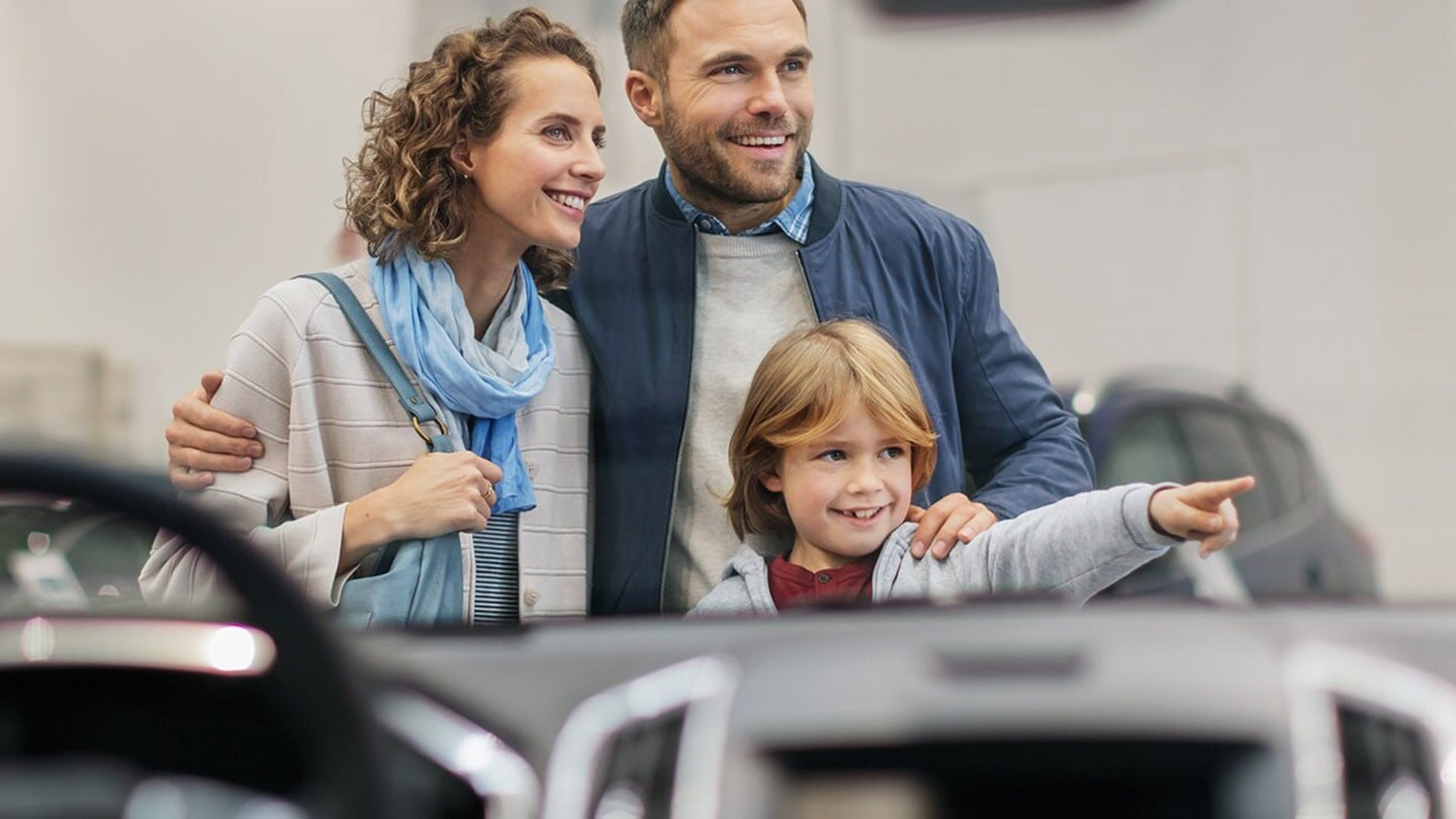 Family opposite car