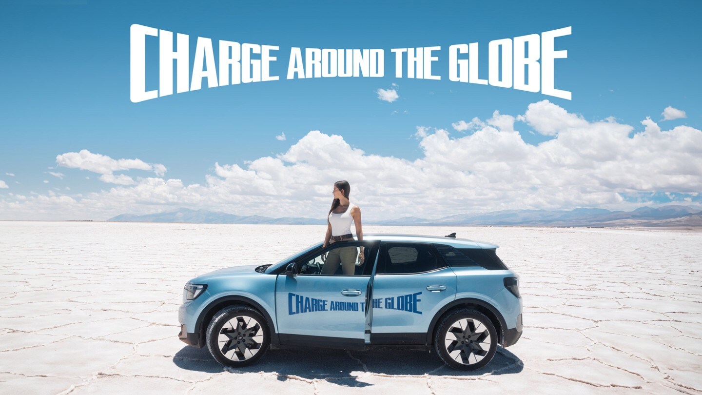 Lexie Alford, aka @LexieLimitless, stood with the Ford Explorer at the Charge Around The Globe finish line.