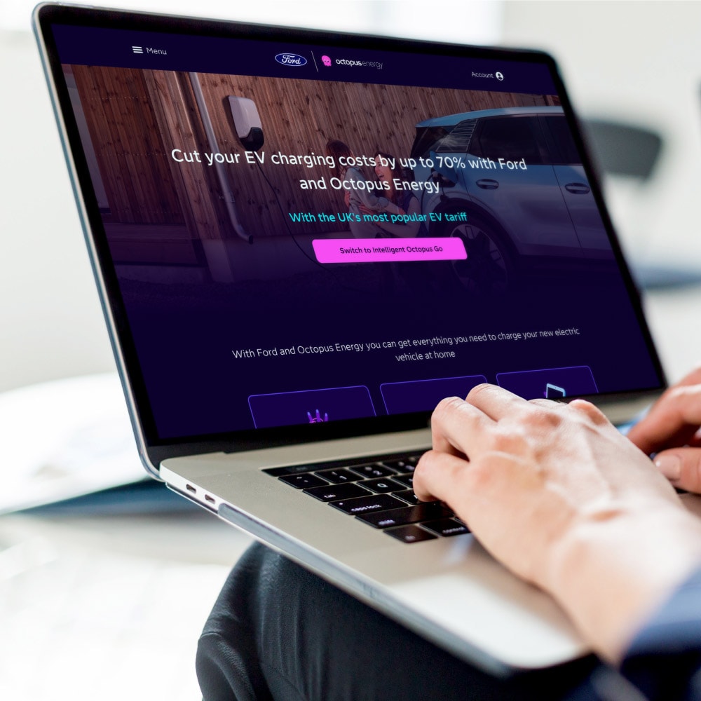 A laptop displaying the Ford and Octopus Energy partnership page about EV home charging costs.