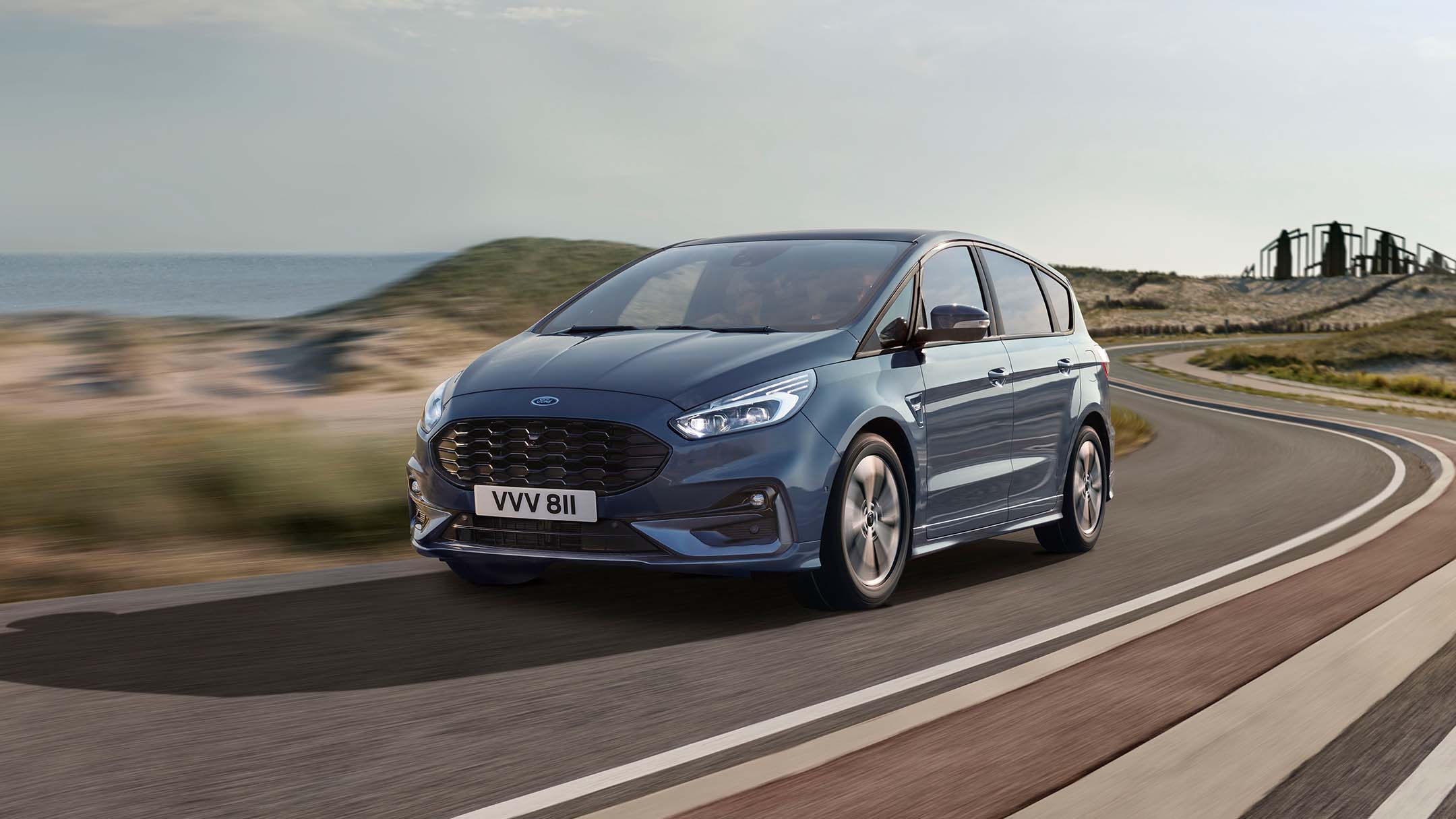 Blue Ford S-Max driving on the road