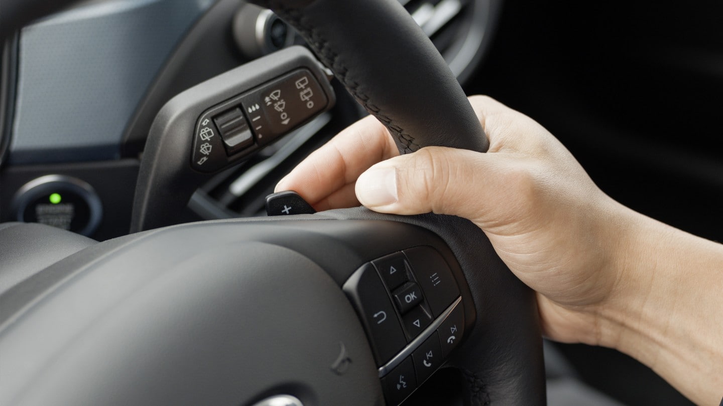 Hand on a driving wheel