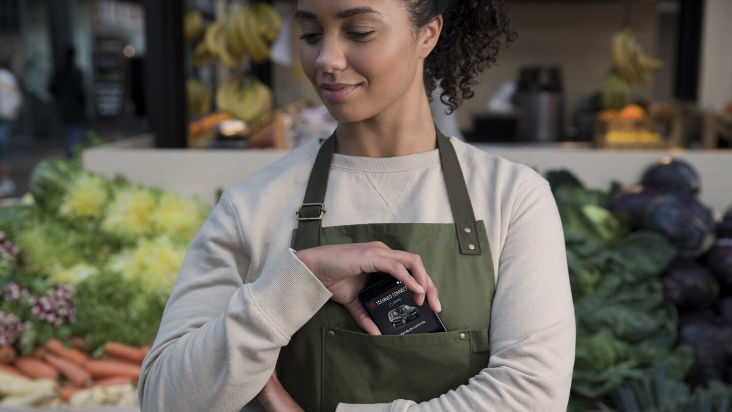 Sales person with mobile with FordPass App