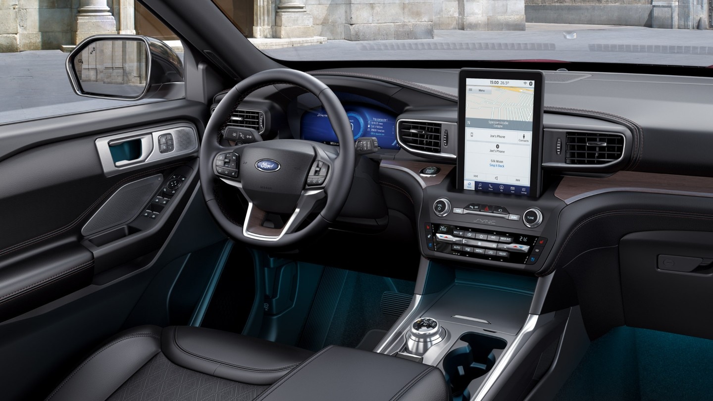 Ford Explorer interior with detail on steering wheel and SYNC screen