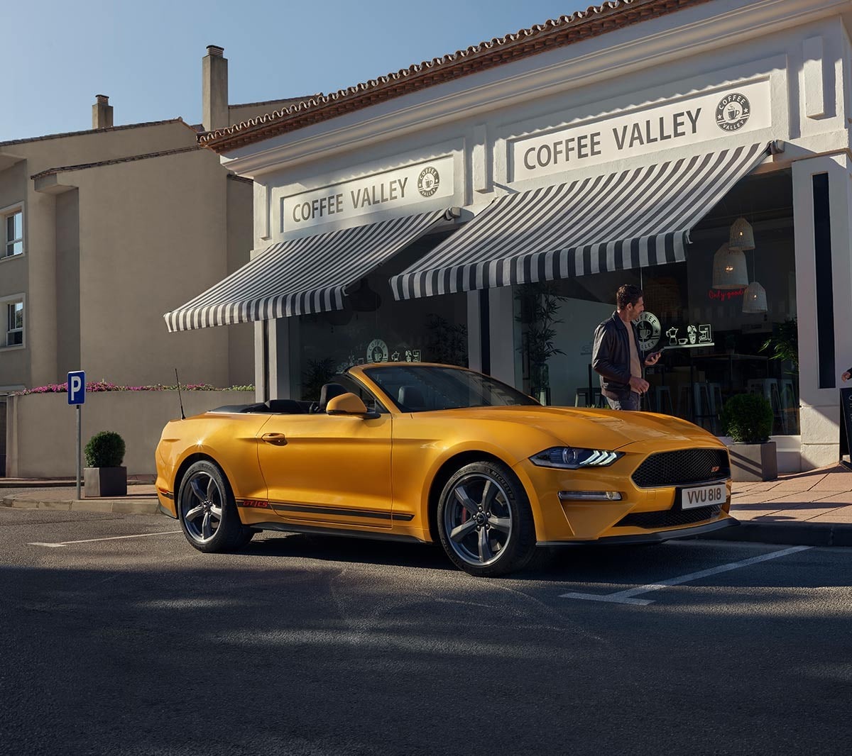 Ford Mustang California Edition parked infront of a coffee shop.