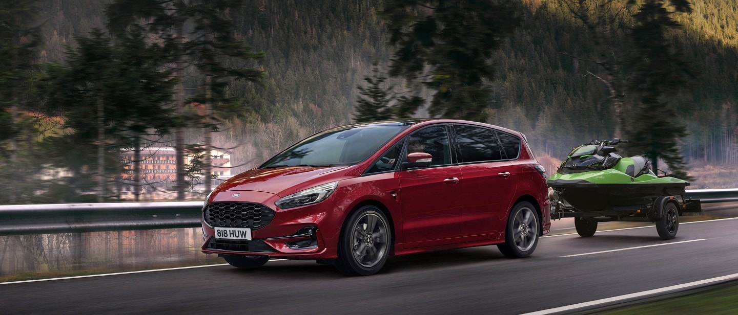 Red Ford S-Max driving on the road