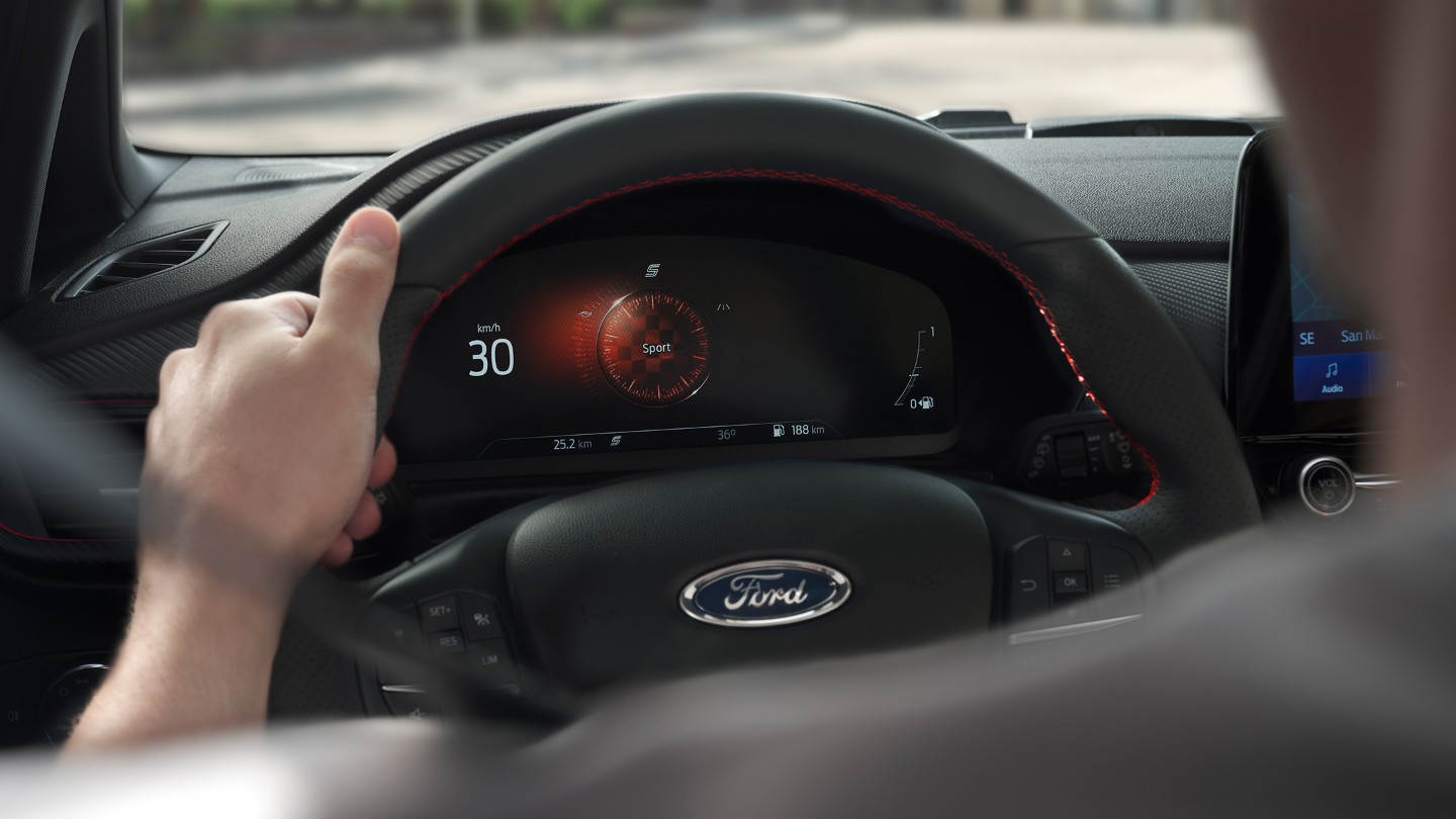 Man holding a steering wheel