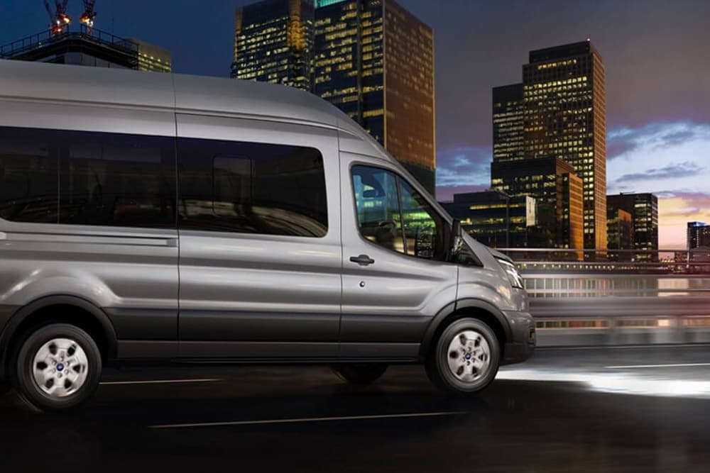 Ford Transit Minibus driving in night with headlingts on