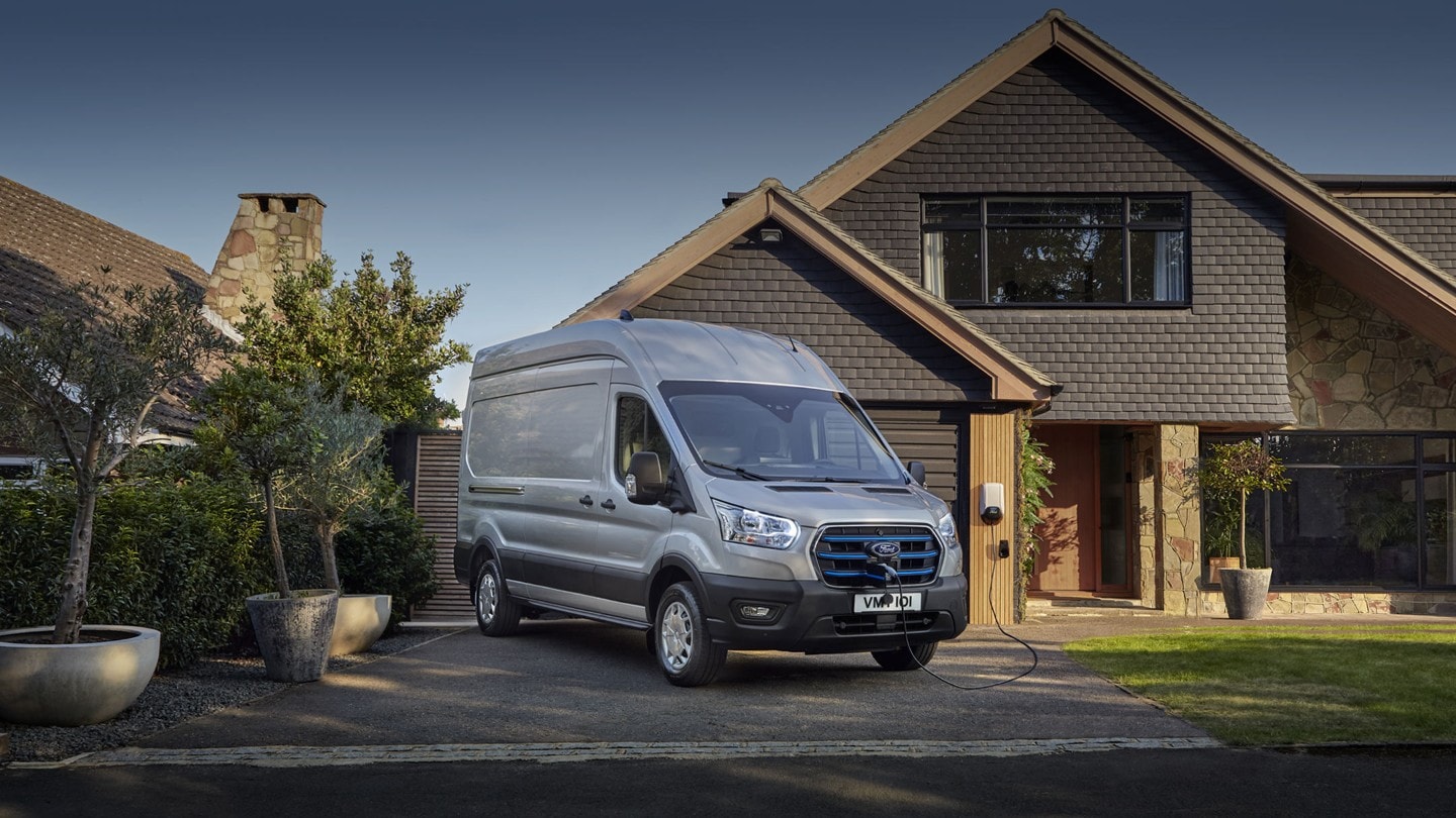 All-Electric Ford Transit Van parking outside a house