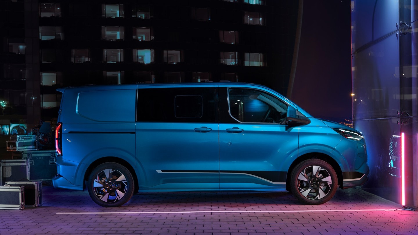 Side-on view of a blue Ford Transit Custom double cab-in-van