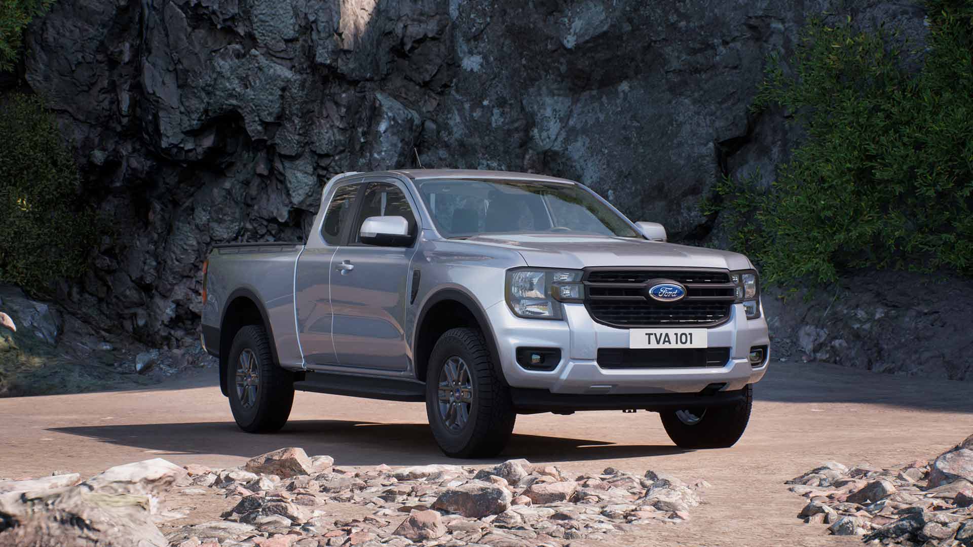 Ford Ranger Super Cab XLT color argento parcheggiato su terreno roccioso.