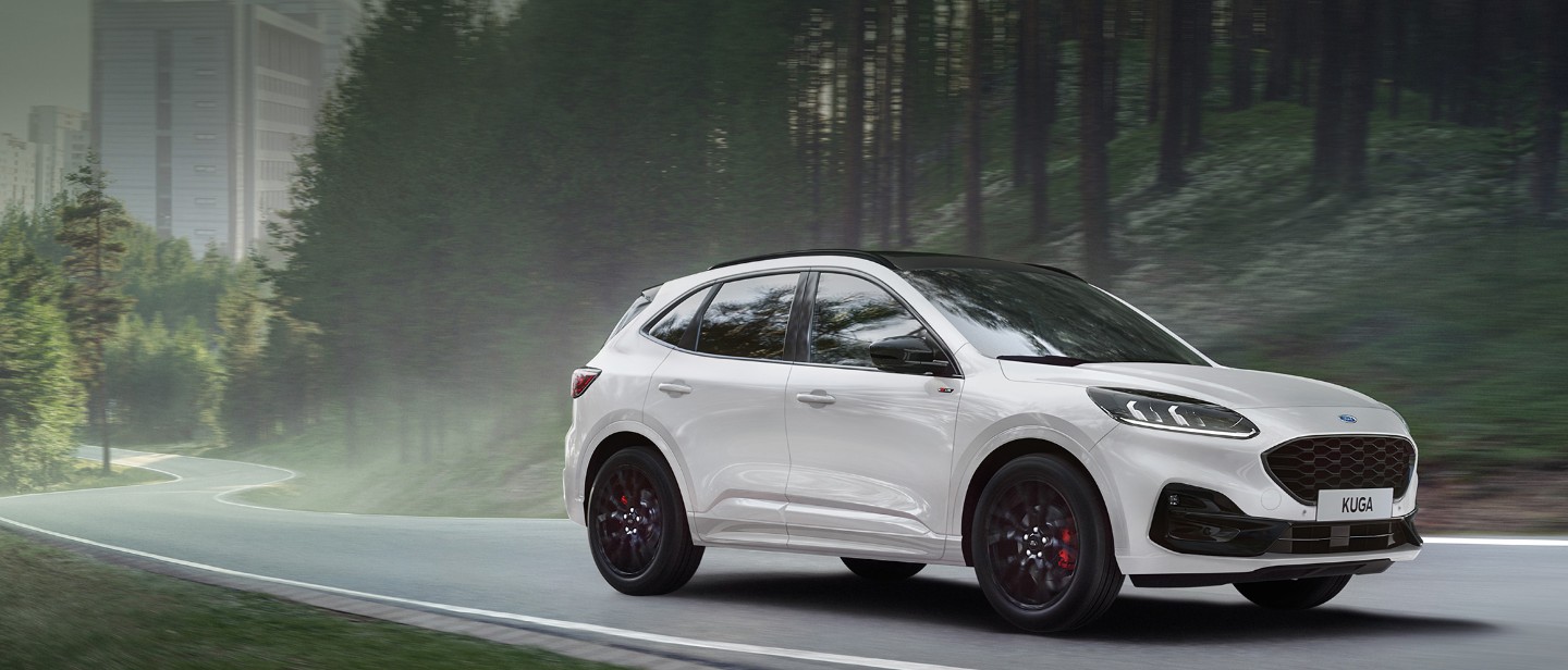 Ford Kuga driving out of a city