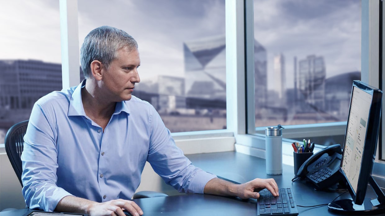 Man sitting in front of a desk